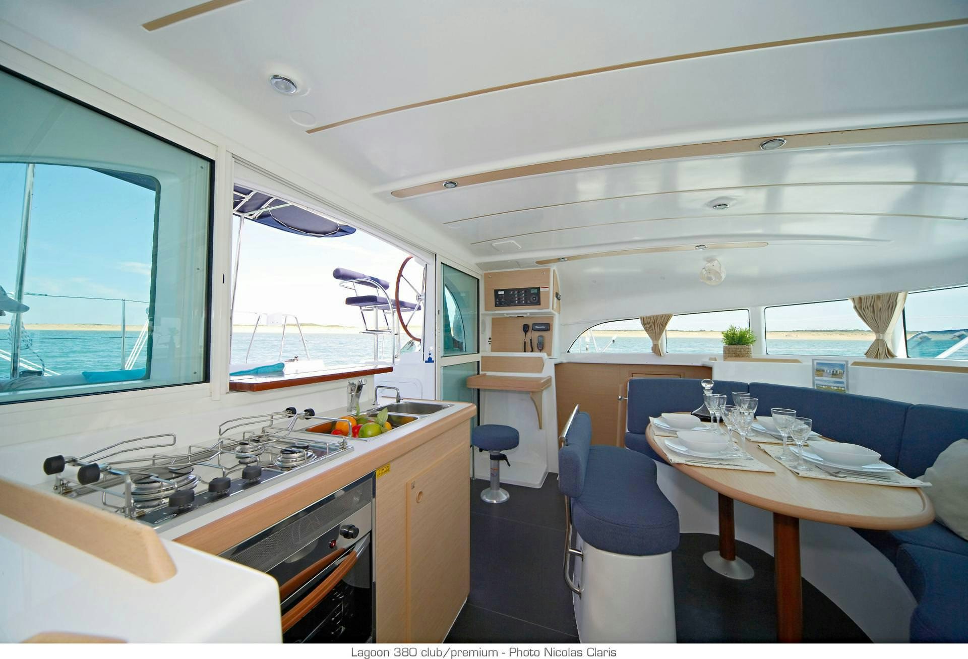 a kitchen with a table and chairs aboard HARMONY Yacht for Charter