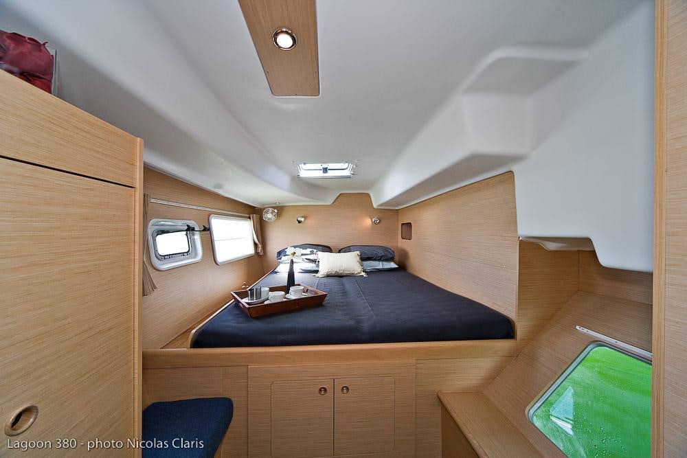 a bed in a room aboard HARMONY Yacht for Charter