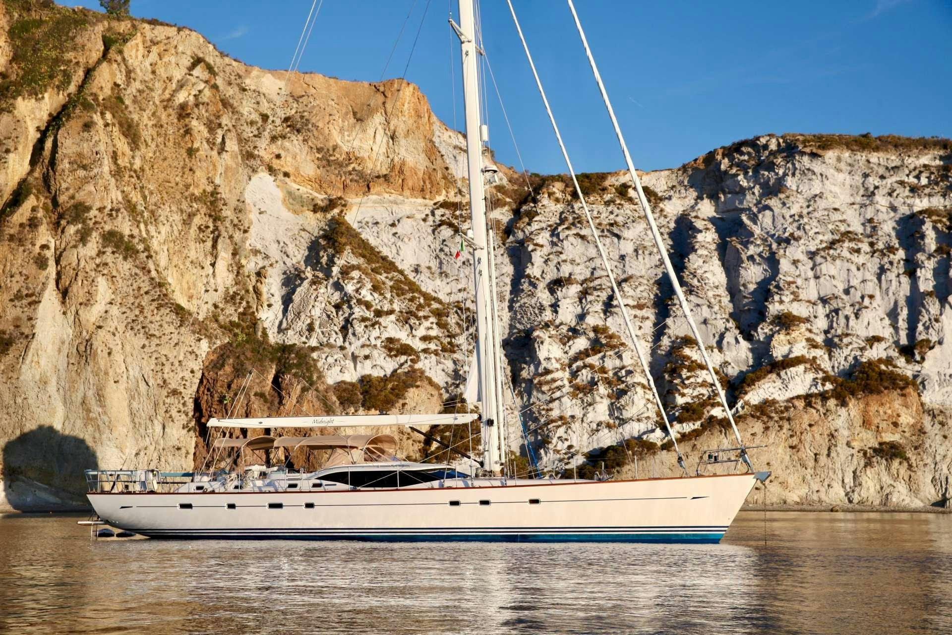 a boat sailing in the water aboard MIDNIGHT Yacht for Charter