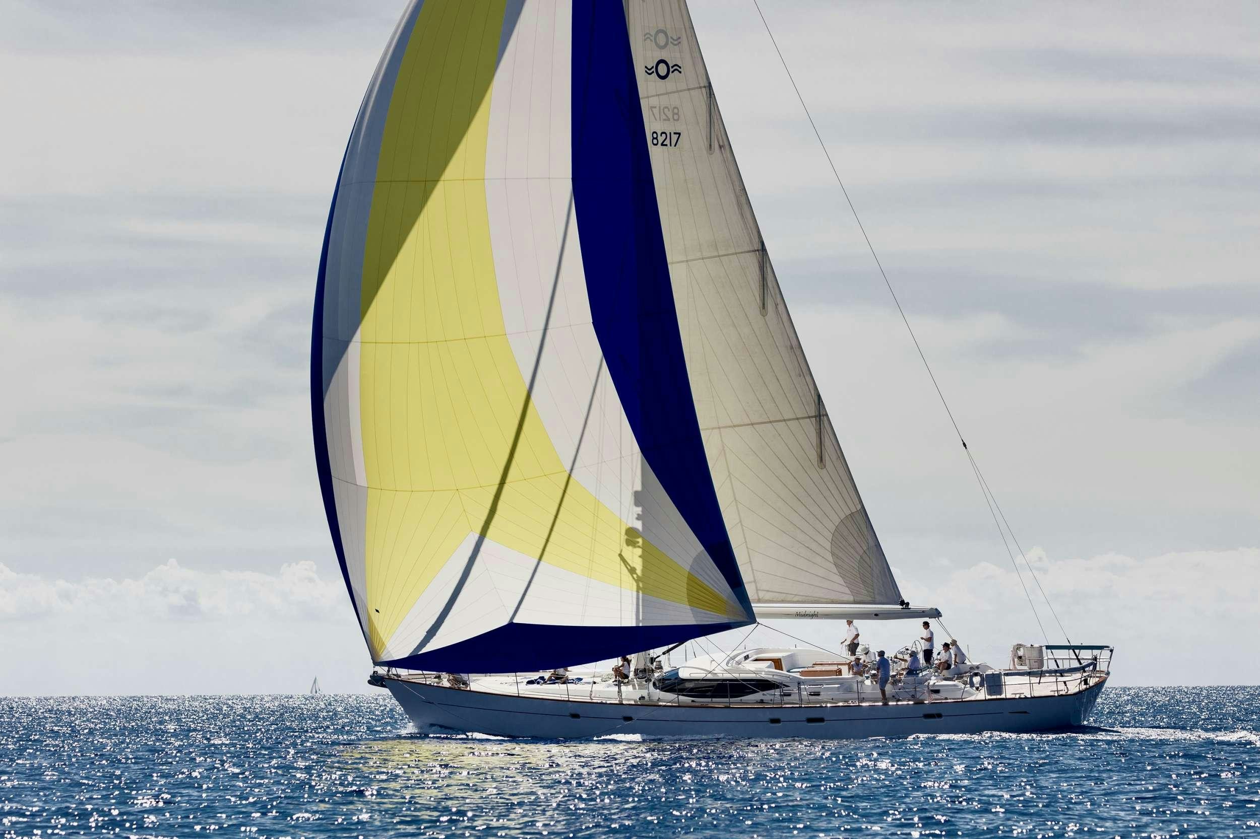 a sailboat in the ocean aboard MIDNIGHT Yacht for Charter