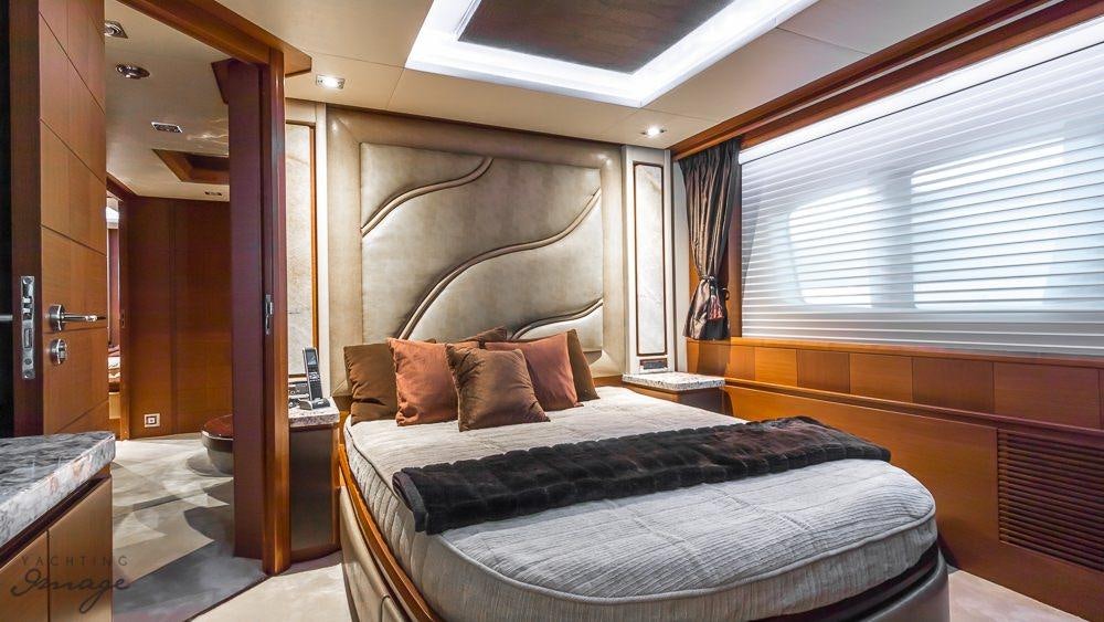 a bed in a room aboard 105 YCG Yacht for Charter