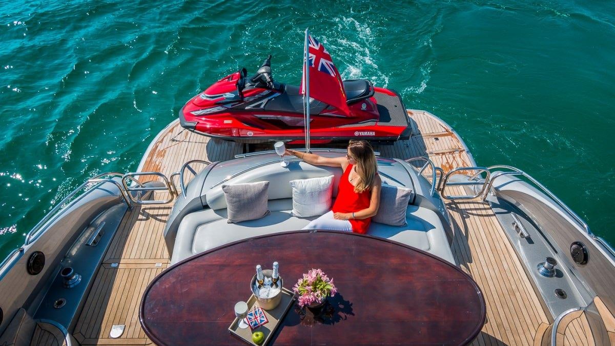 a person sitting in a boat aboard H2 Yacht for Charter