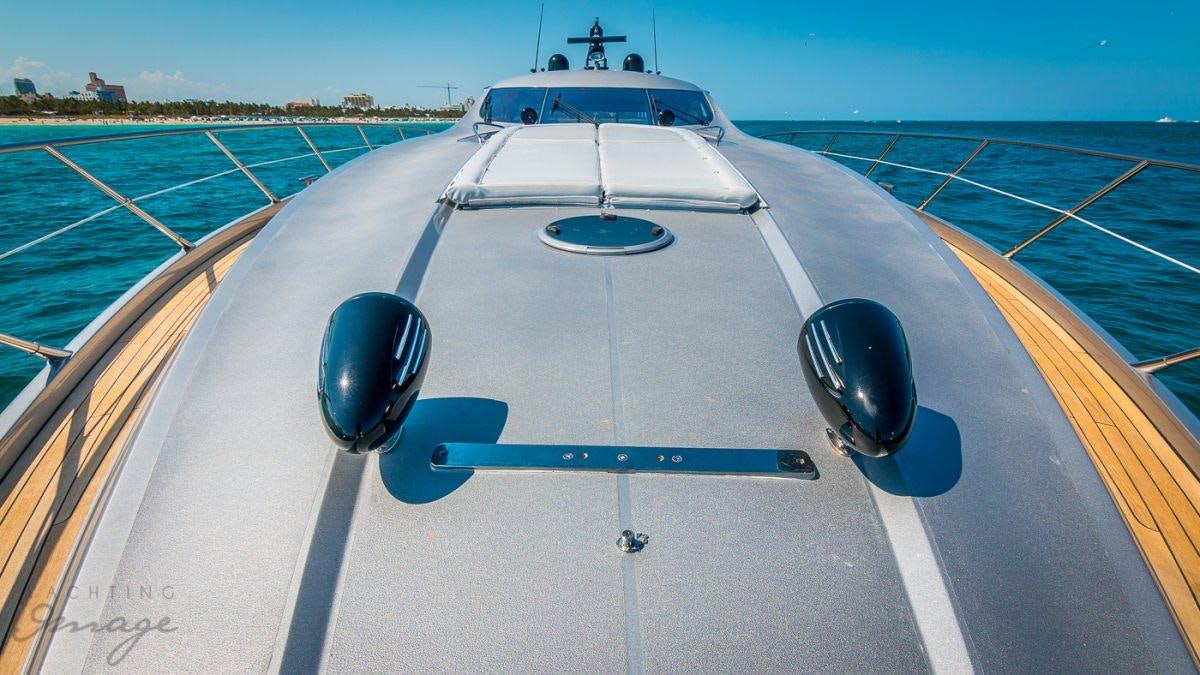 a white airplane on a runway aboard H2 Yacht for Charter