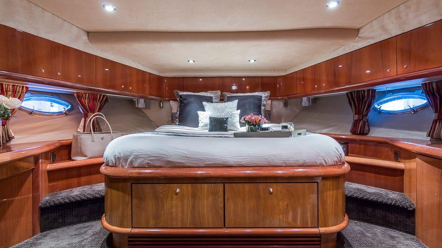 a bed in a cabin aboard H2 Yacht for Charter