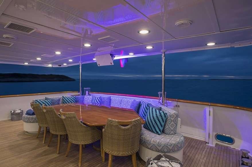 a room with a table and chairs aboard SWEET ESCAPE Yacht for Charter