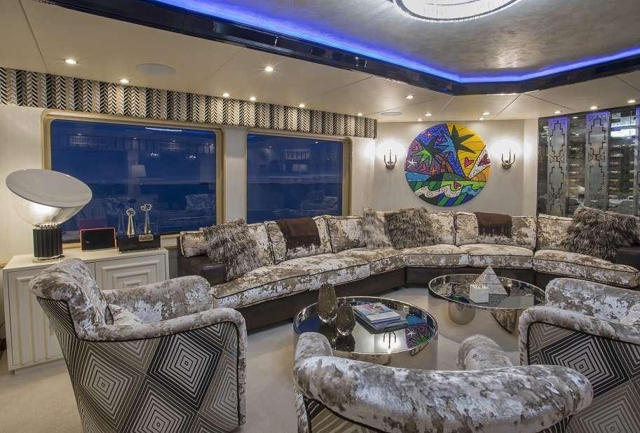 a living room with a large screen aboard SWEET ESCAPE Yacht for Charter
