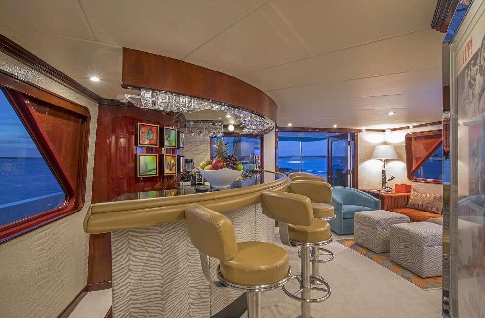 a living room with a large window aboard SWEET ESCAPE Yacht for Charter