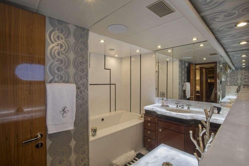 a bathroom with a large mirror aboard SWEET ESCAPE Yacht for Charter