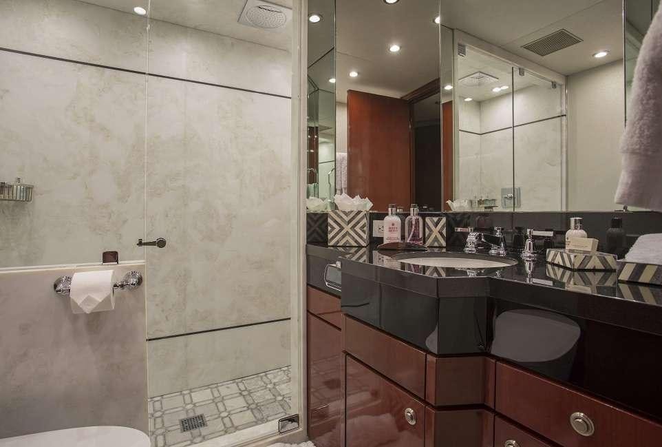 a bathroom with a large mirror aboard SWEET ESCAPE Yacht for Charter