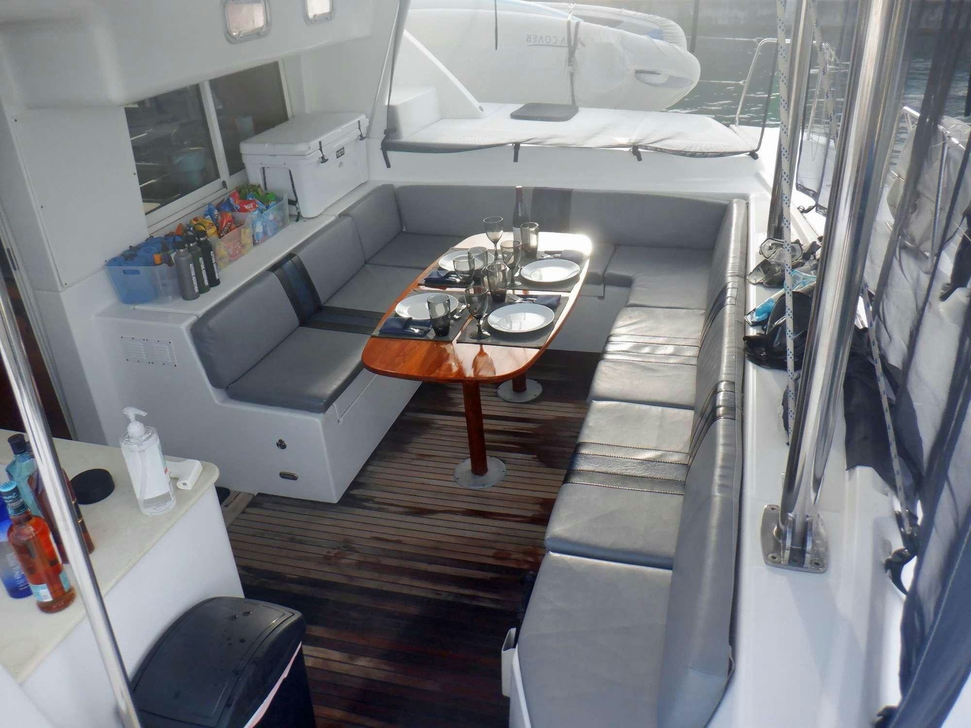 a small kitchen with a table aboard ALTITUDE ADJUSTMENT Yacht for Charter