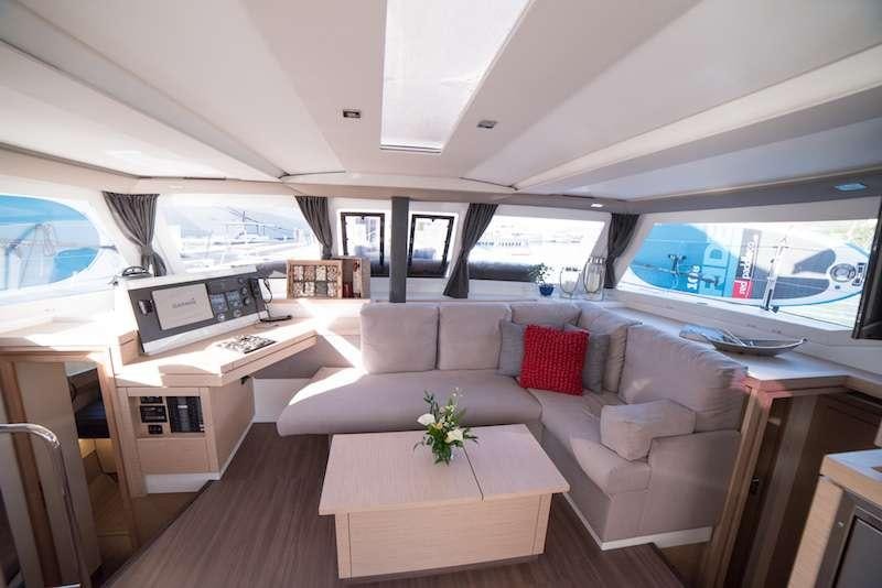 a living room with a couch and a table aboard 3 SISTERS Yacht for Charter