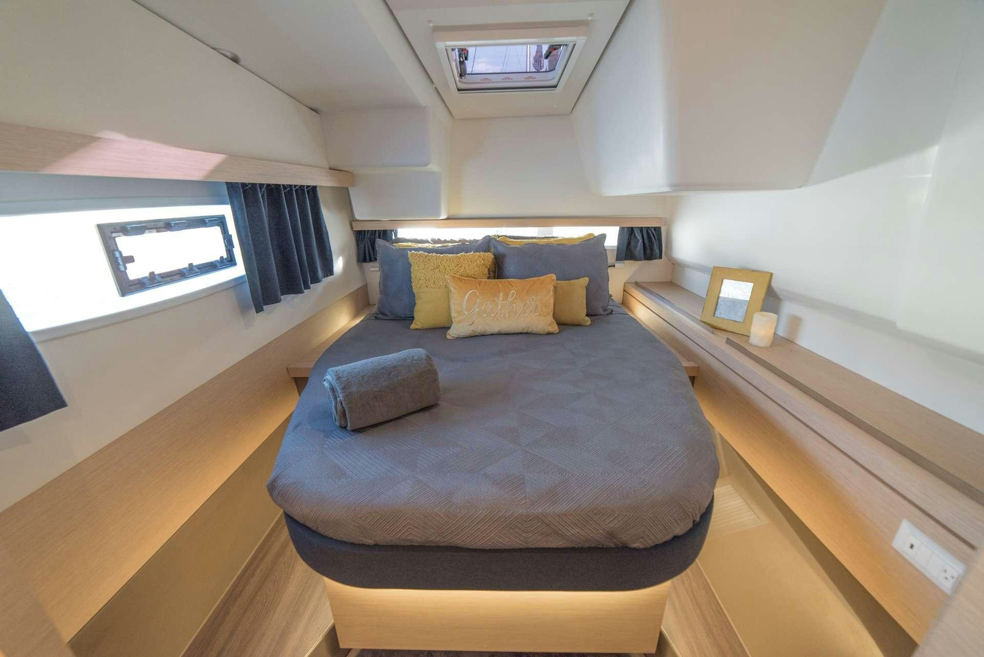 a bed in a room aboard 3 SISTERS Yacht for Charter