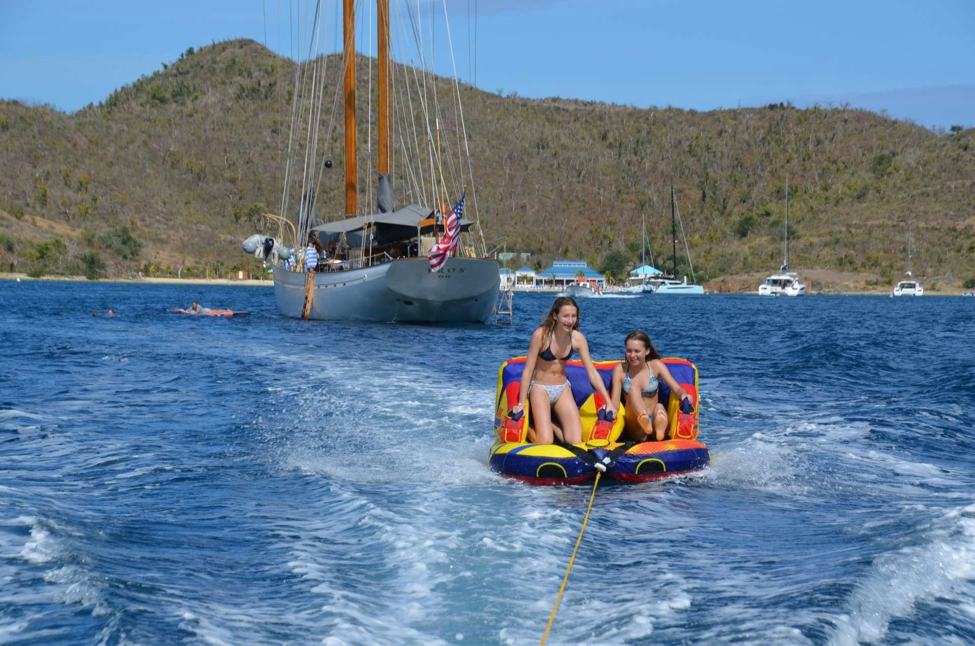 a group of people in a sailboat on the water aboard EROS Yacht for Charter