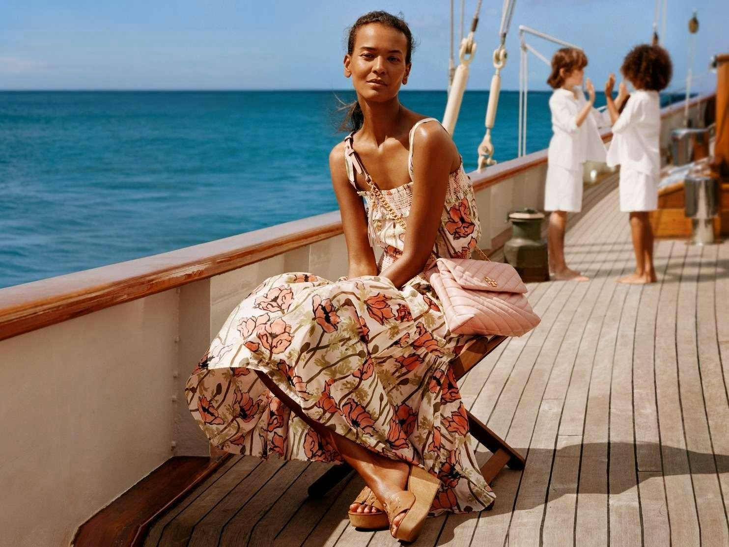 Jessica Lucas sitting on a boat aboard EROS Yacht for Charter