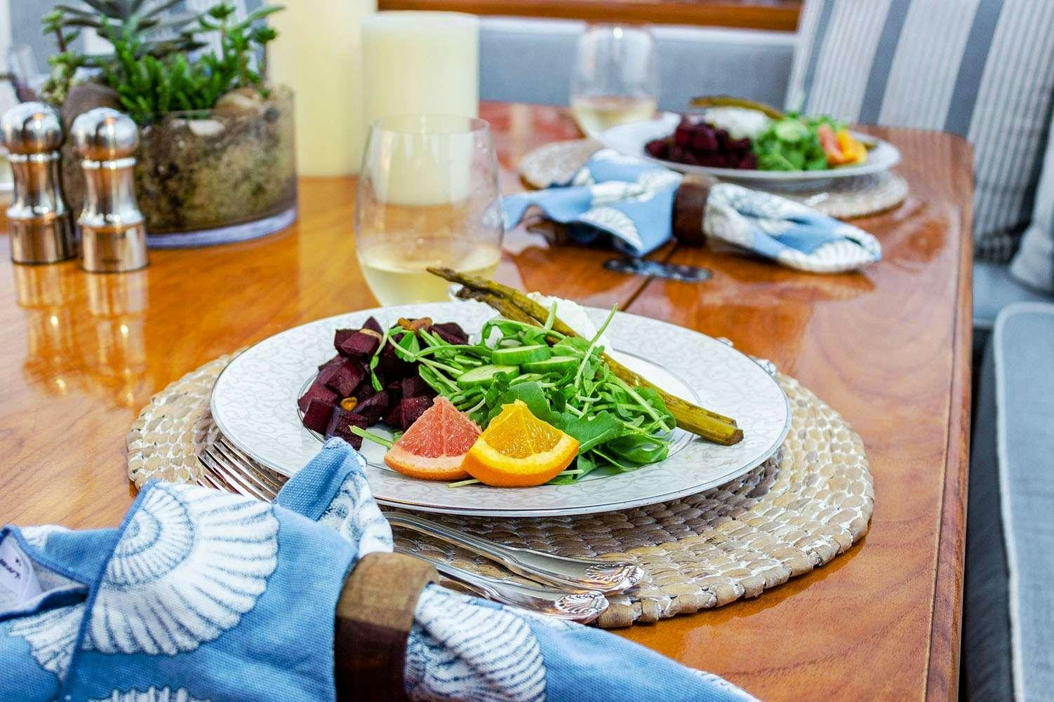 a plate of food on a table aboard EROS Yacht for Charter