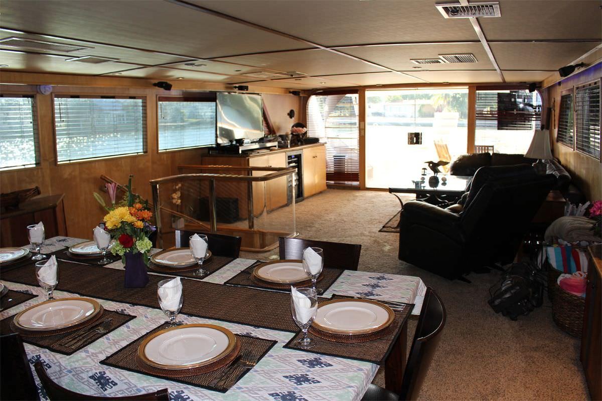 a dining room with a table and chairs aboard PURE KNIGHT LIFE Yacht for Charter