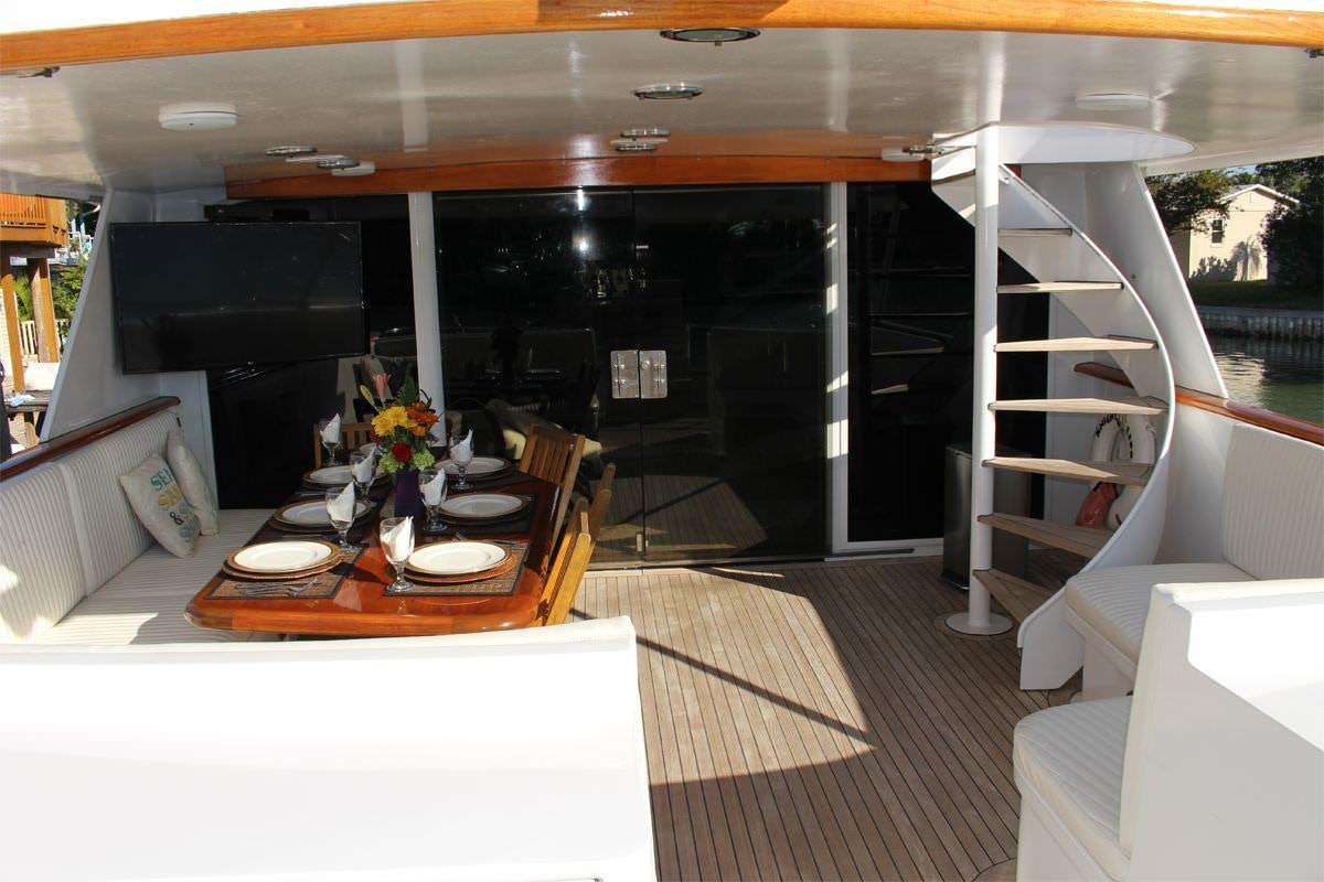 a room with a table and chairs aboard PURE KNIGHT LIFE Yacht for Charter