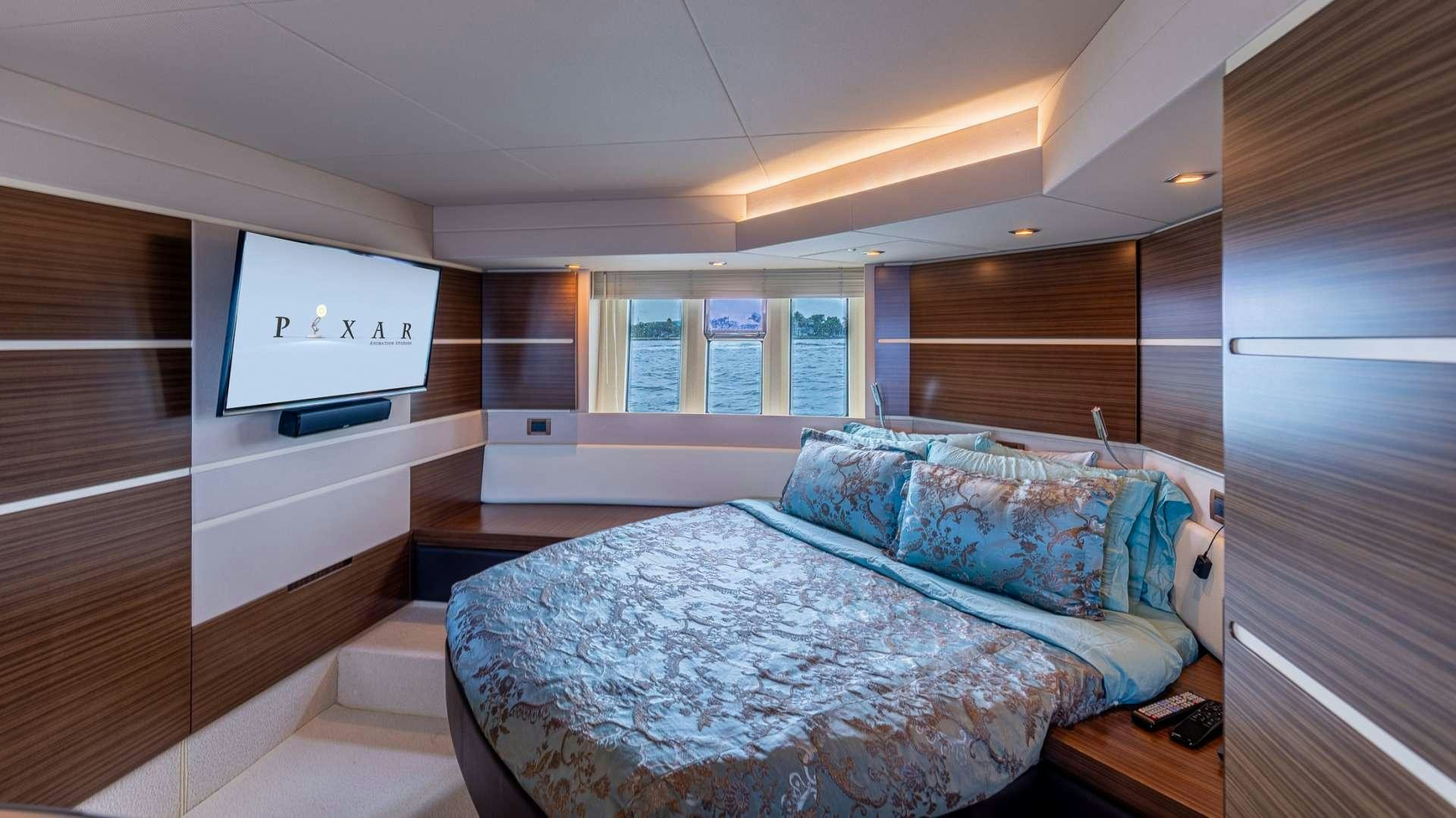 a bedroom with a bed aboard ROLLIN DEEP Yacht for Charter