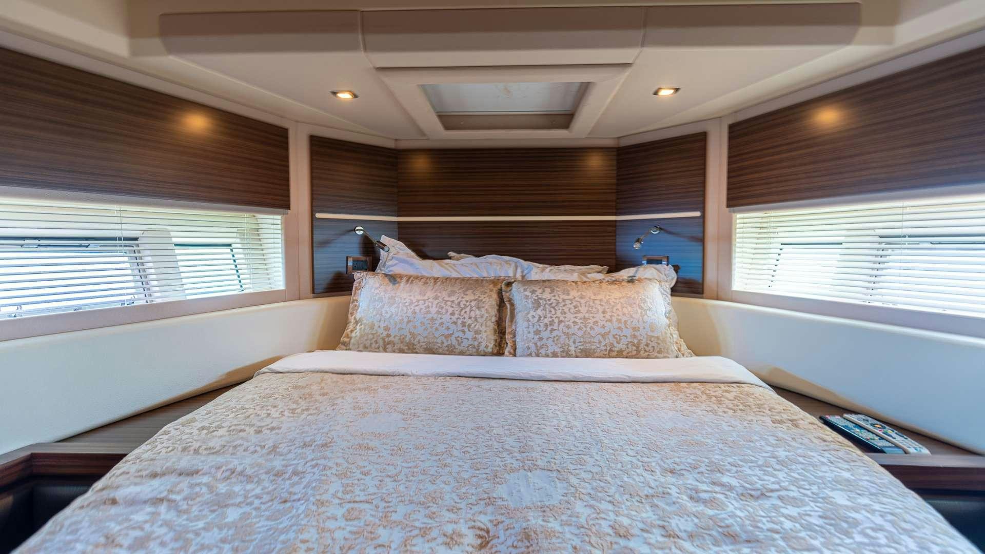 a bed with pillows aboard ROLLIN DEEP Yacht for Charter
