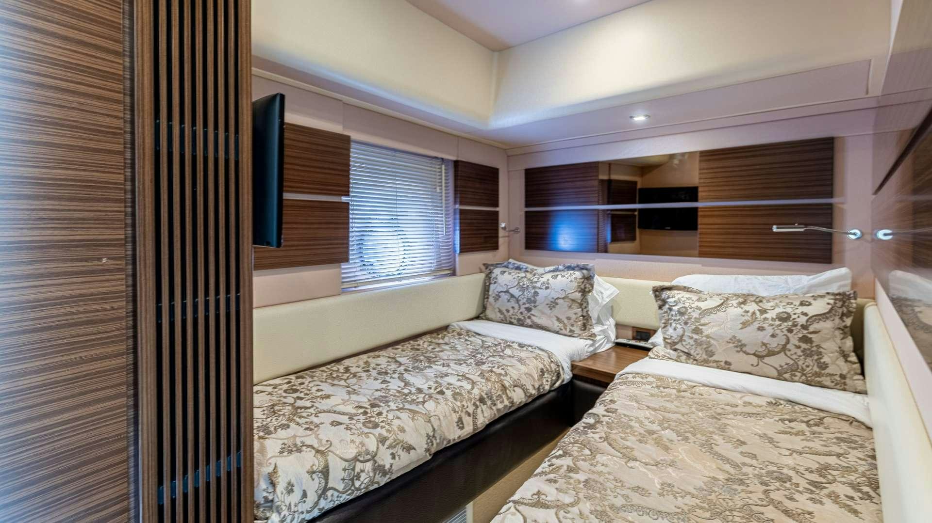 a couple of beds in a room aboard ROLLIN DEEP Yacht for Charter