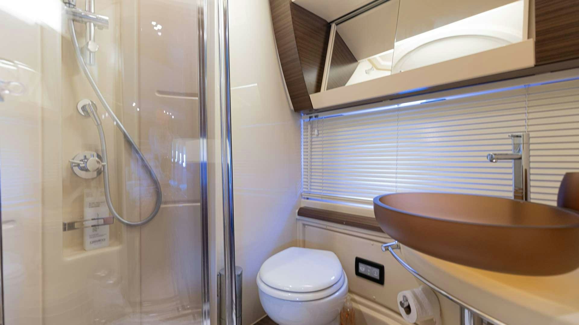 a bathroom with a sink and toilet aboard ROLLIN DEEP Yacht for Charter