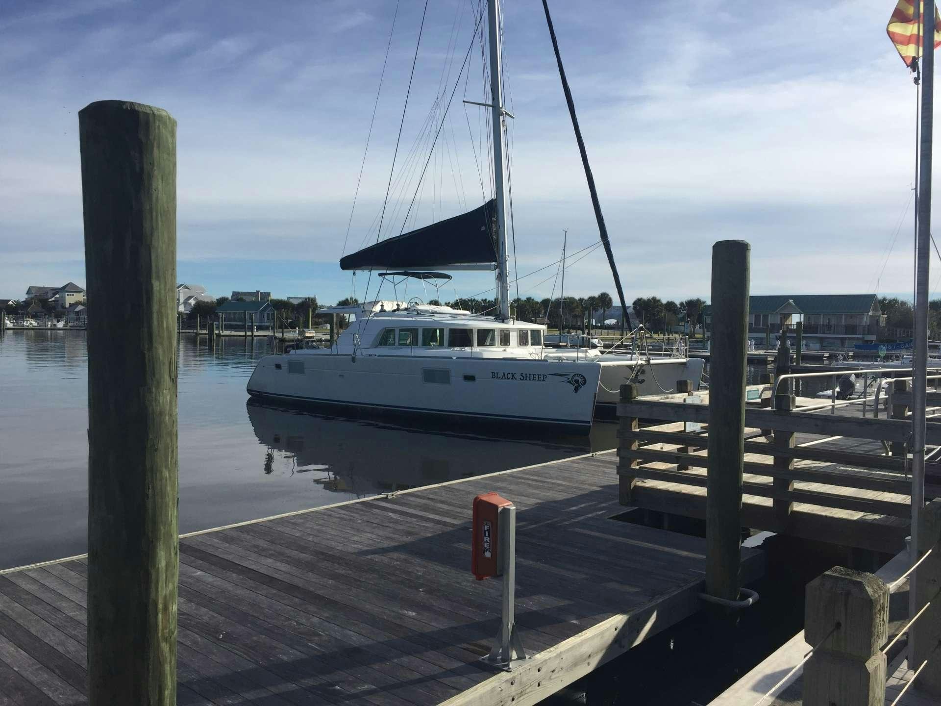 a boat is parked on the dock aboard BLACK SHEEP Yacht for Charter