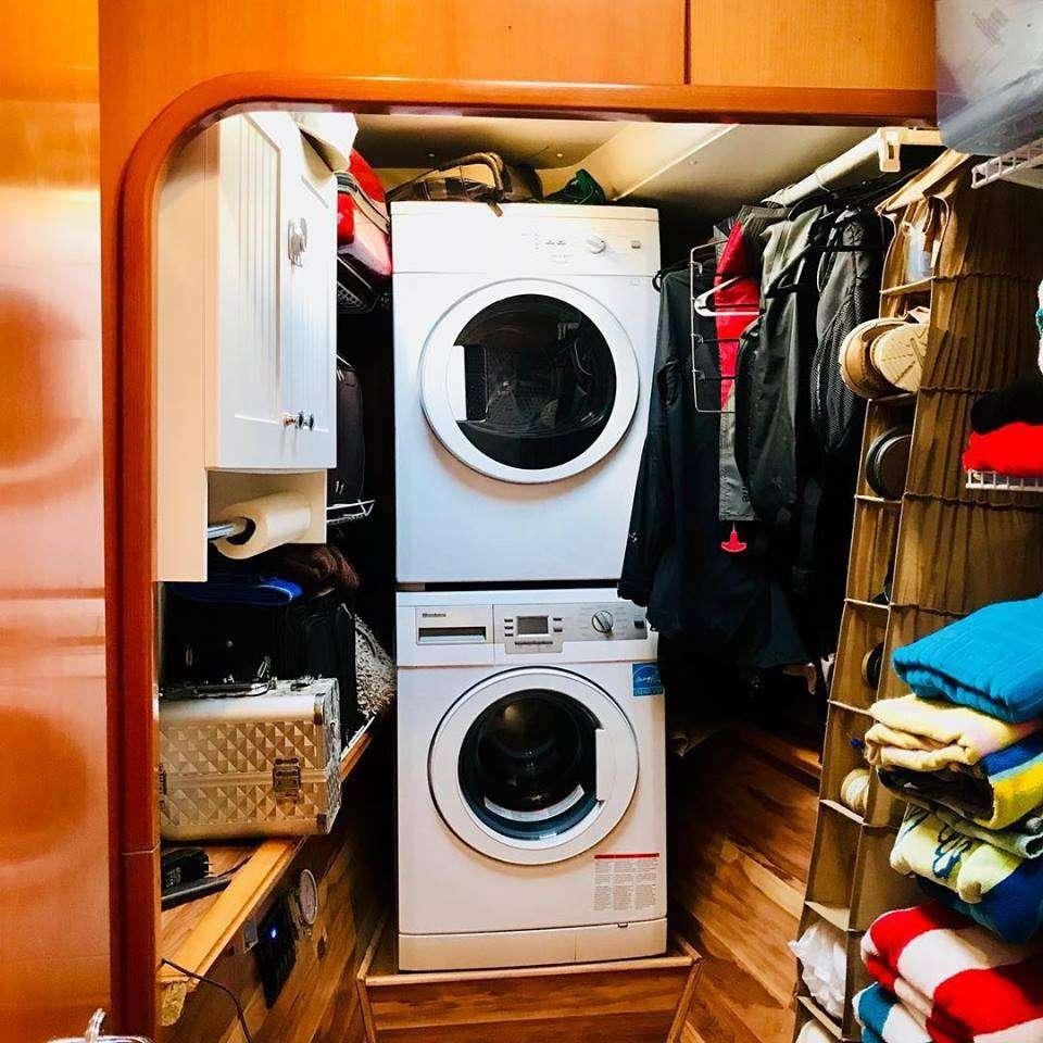 a closet full of clothes and clothes aboard BLACK SHEEP Yacht for Charter