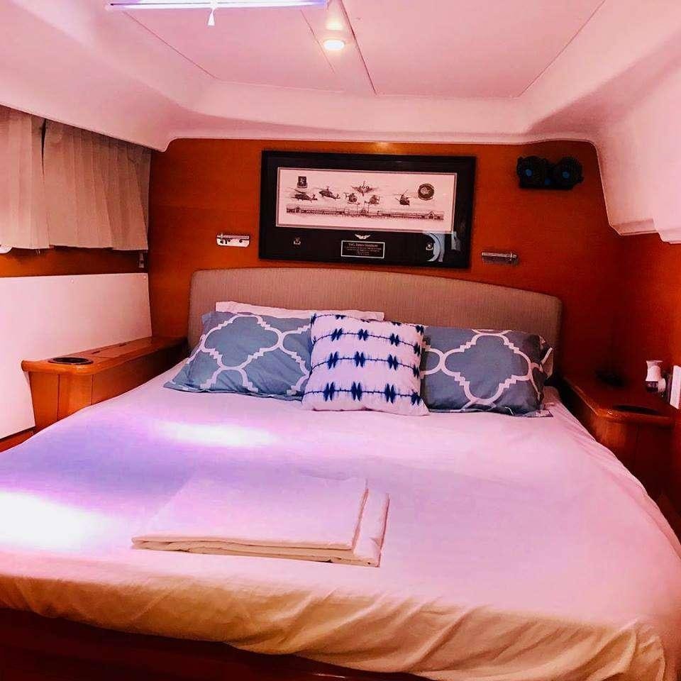 a bed with pillows aboard BLACK SHEEP Yacht for Charter