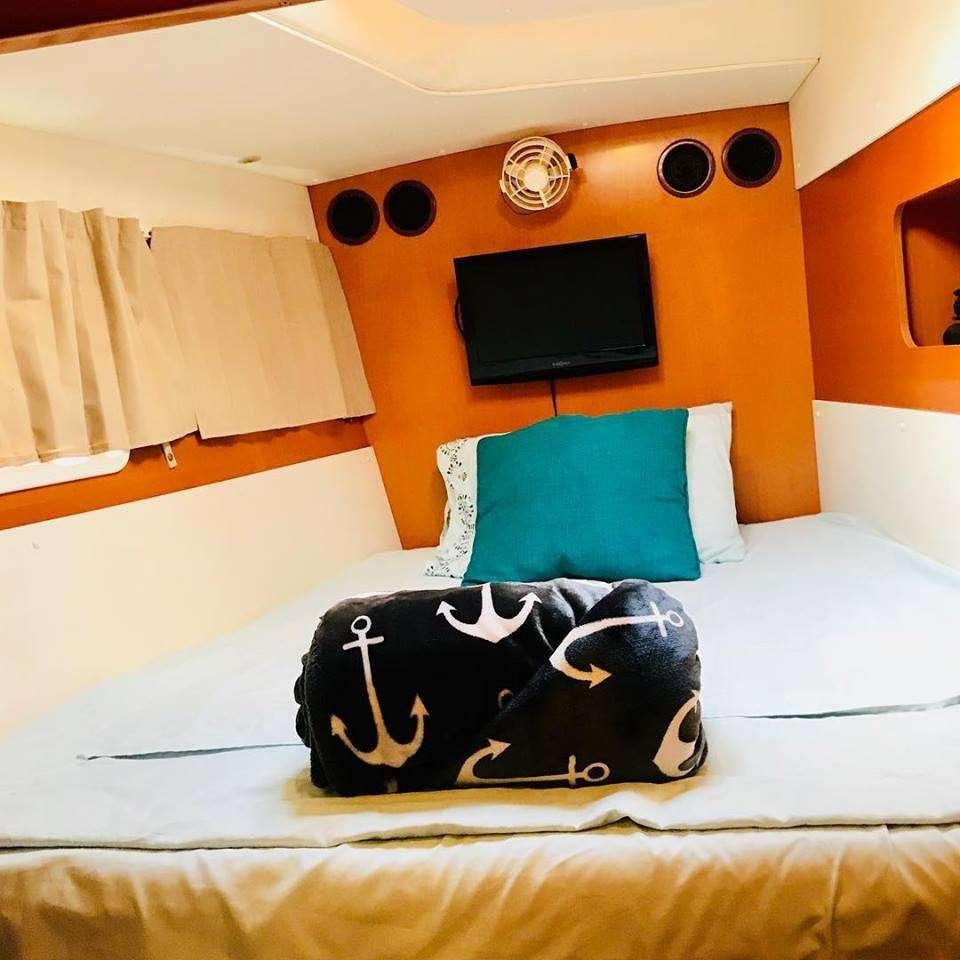 a stuffed animal on a bed aboard BLACK SHEEP Yacht for Charter