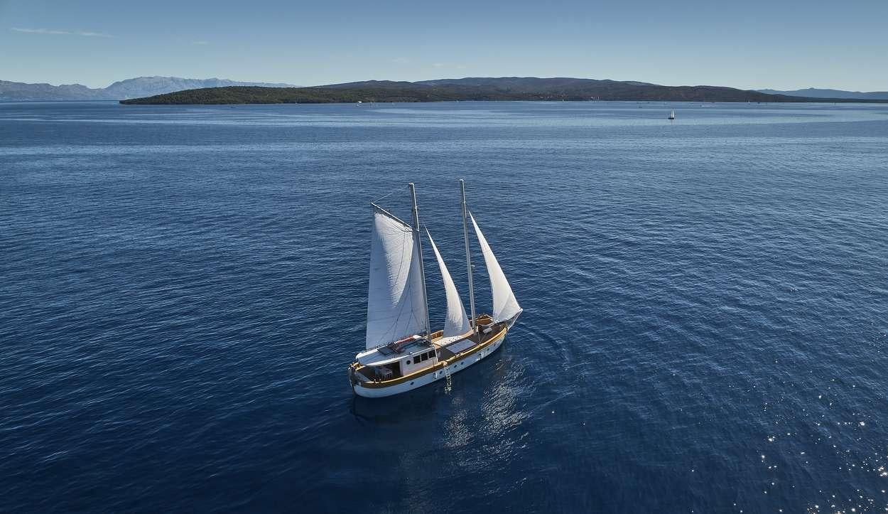a boat sailing on the water aboard ARDURA Yacht for Charter