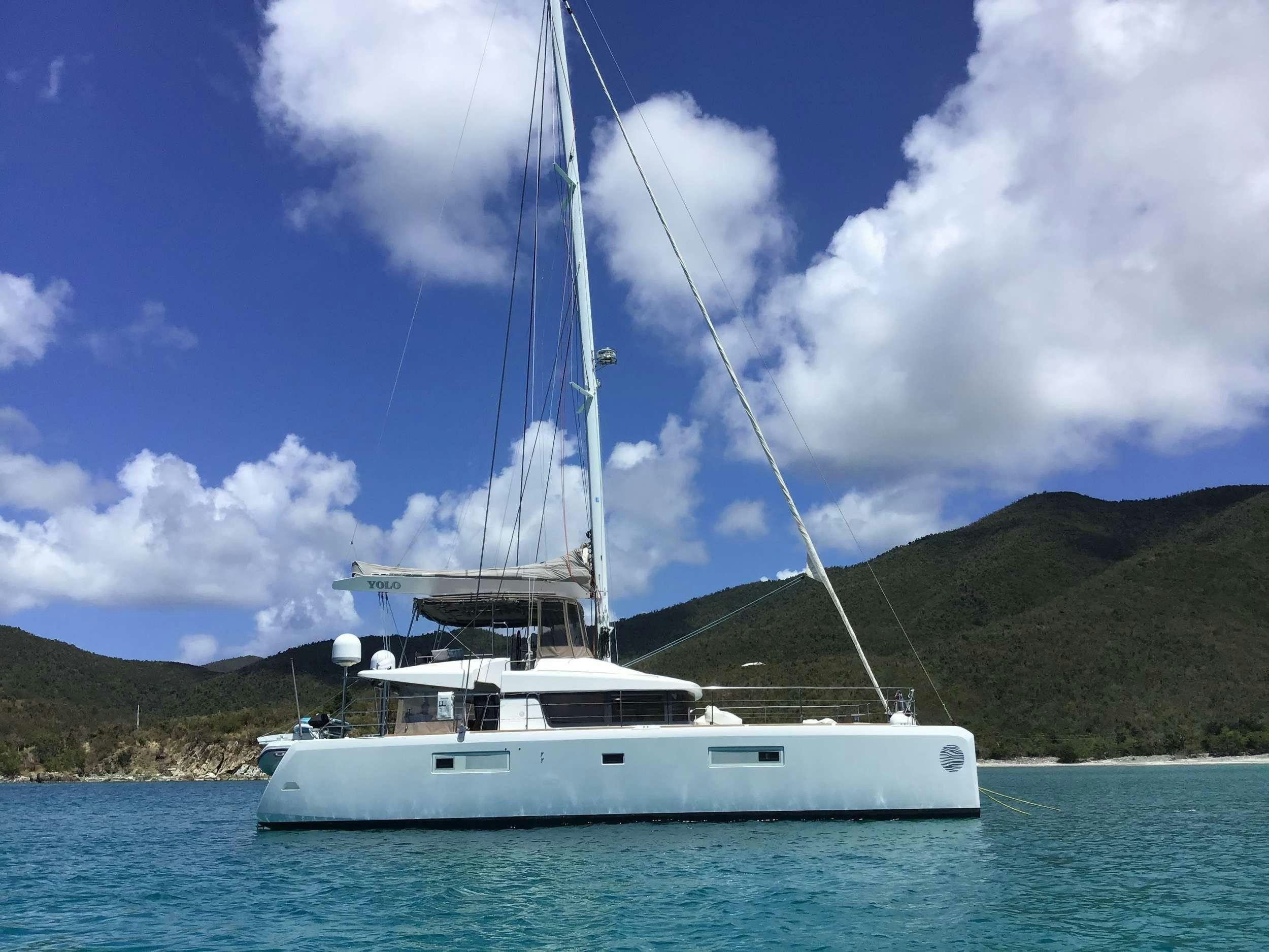 a white boat on the water aboard YOLO II Yacht for Charter