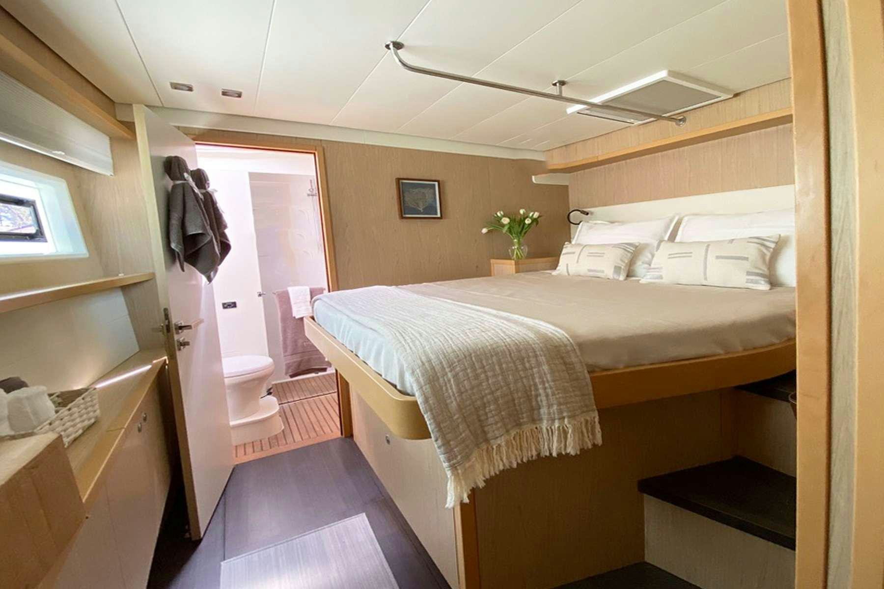 a room with two beds aboard YOLO II Yacht for Charter