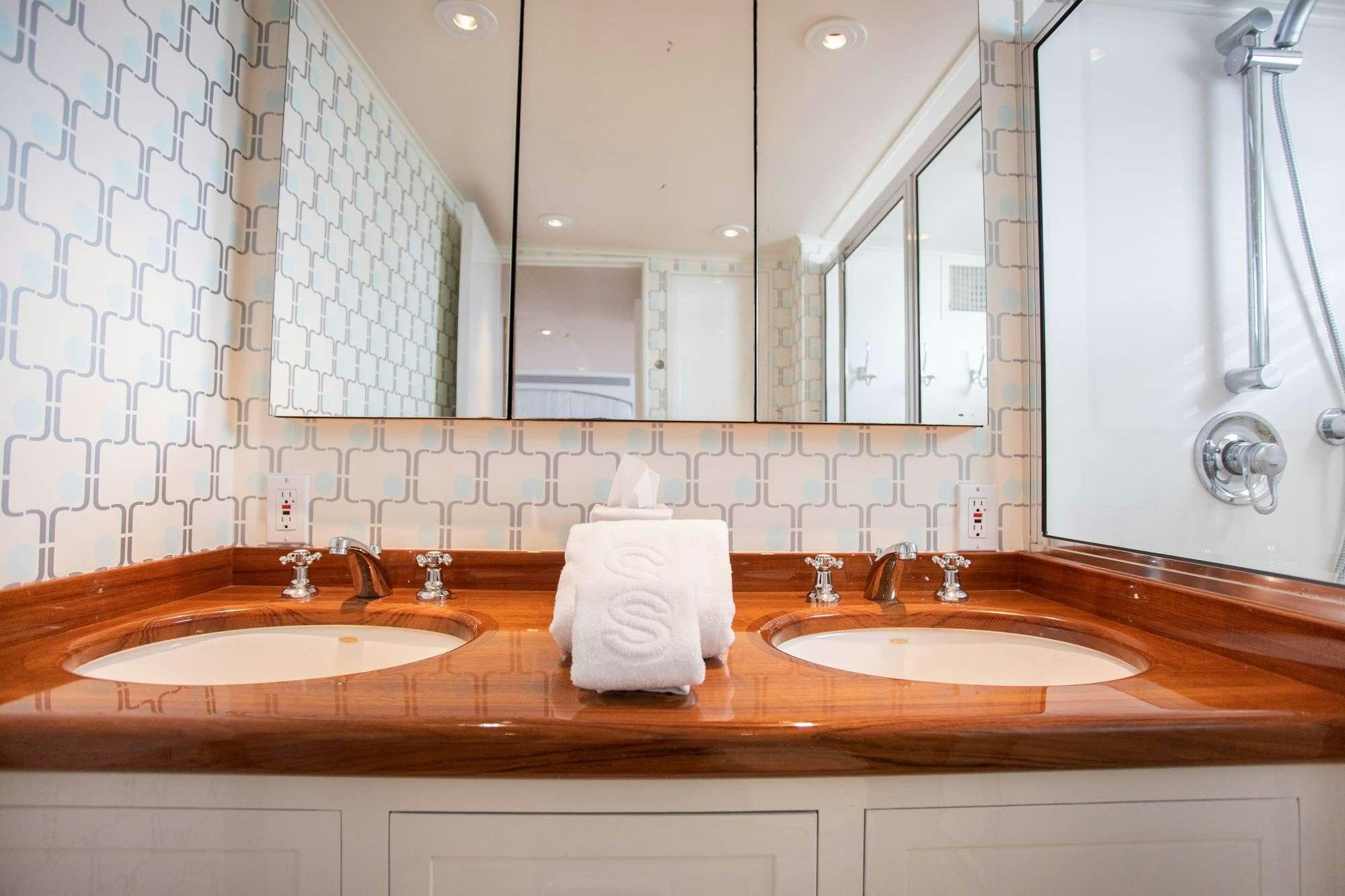 a bathroom with two sinks aboard SOVEREIGN Yacht for Charter