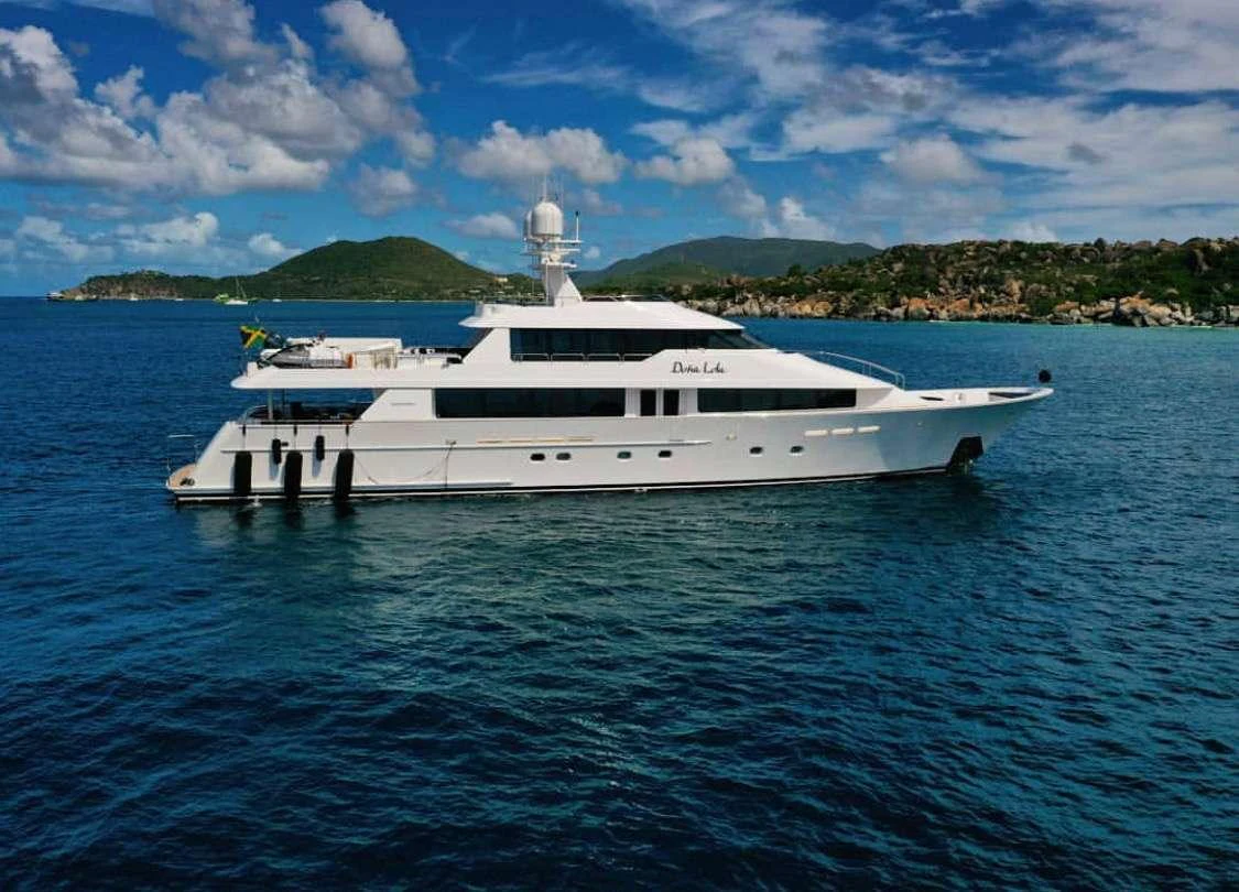 a white yacht in the water aboard DONA LOLA Yacht for Charter