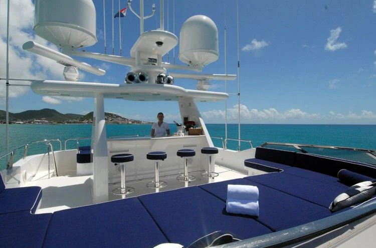 a boat with a person sitting on it aboard DONA LOLA Yacht for Charter