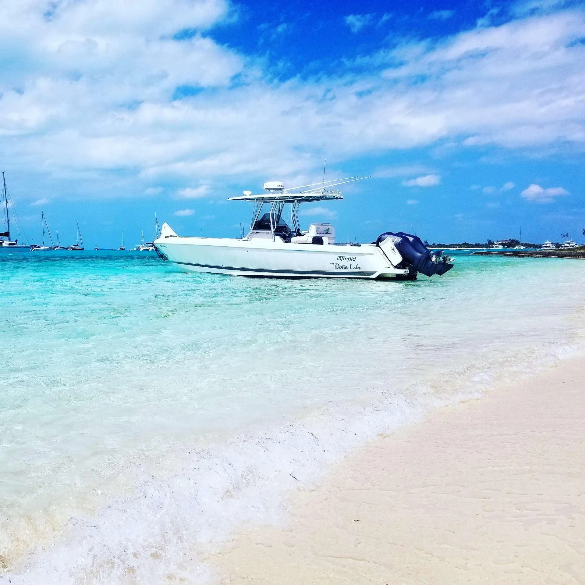 a boat on the beach aboard DONA LOLA Yacht for Charter