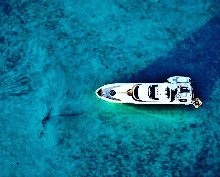 a car on the ground aboard DONA LOLA Yacht for Charter