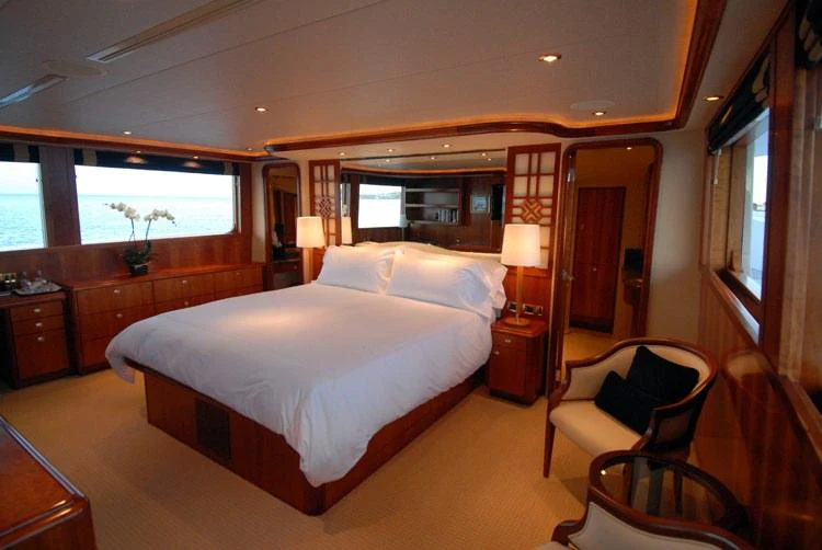 a bedroom with a large bed aboard DONA LOLA Yacht for Charter