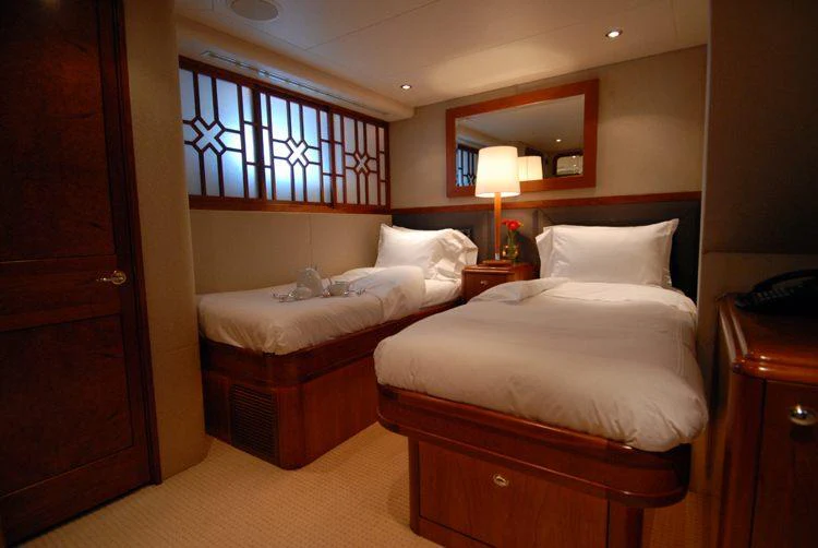 a room with two beds aboard DONA LOLA Yacht for Charter