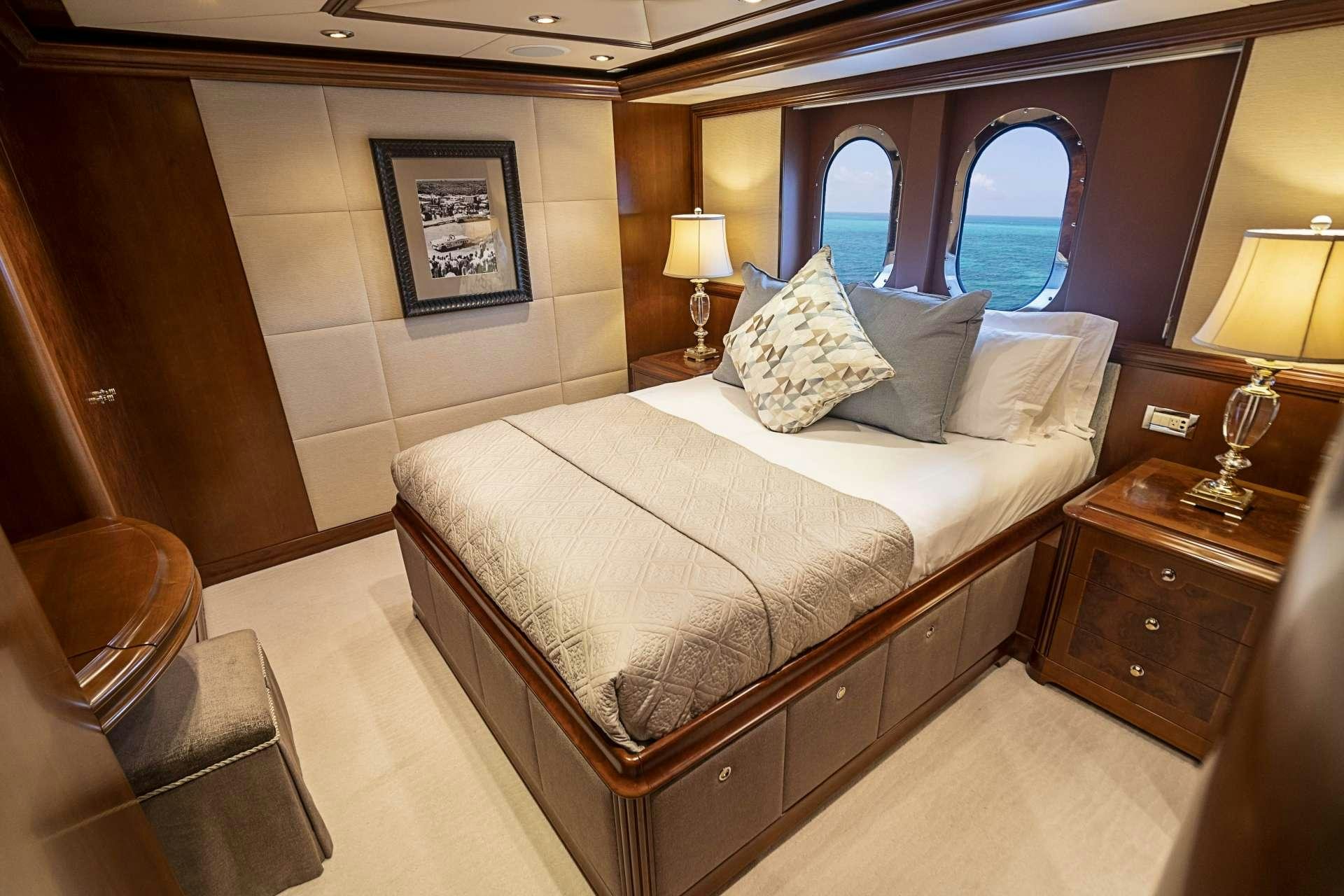 a bed in a room aboard CAMILLE Yacht for Charter