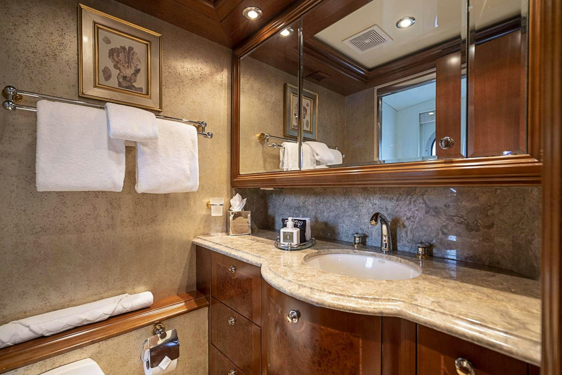 a bathroom with a large mirror aboard CAMILLE Yacht for Charter