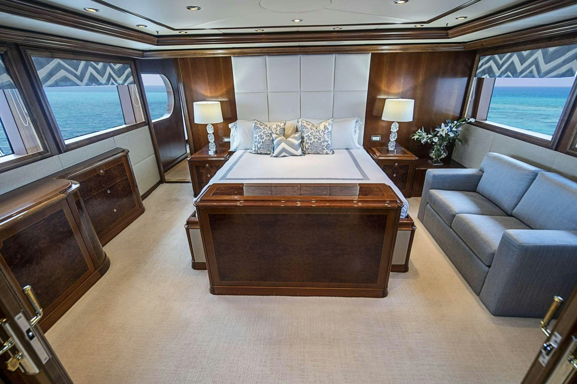 a large bed in a room aboard CAMILLE Yacht for Charter