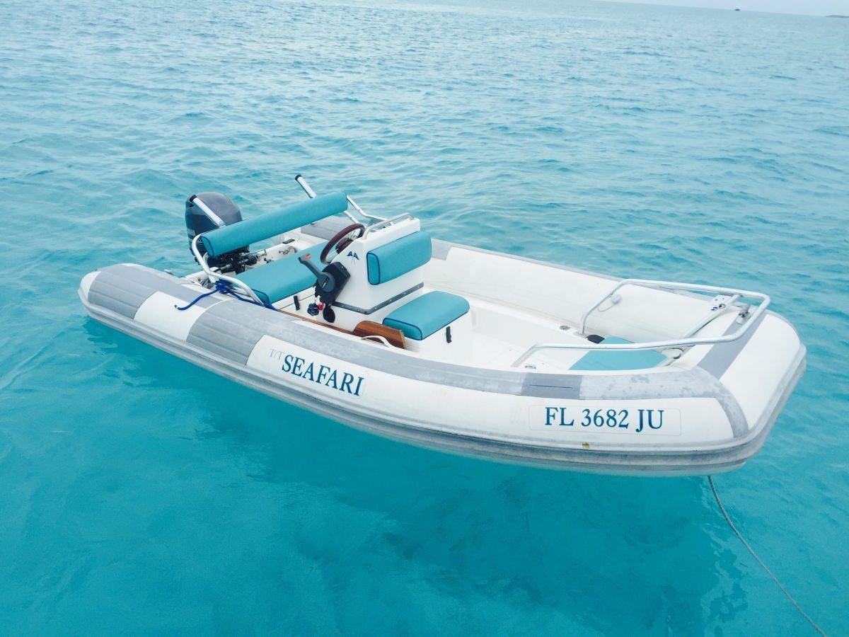 a white boat in the water aboard SEAFARI Yacht for Charter
