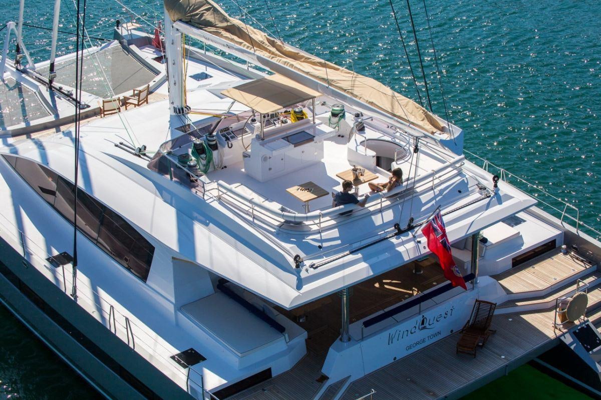 a large white boat on the water aboard WINDQUEST Yacht for Charter