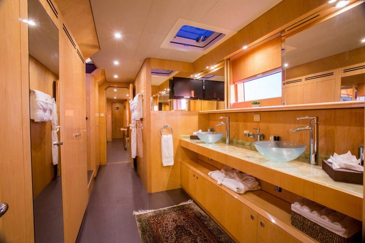 a bathroom with sinks and mirrors aboard WINDQUEST Yacht for Charter