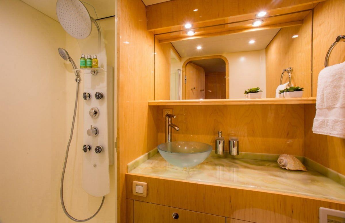 a bathroom with a sink and a shower aboard WINDQUEST Yacht for Charter