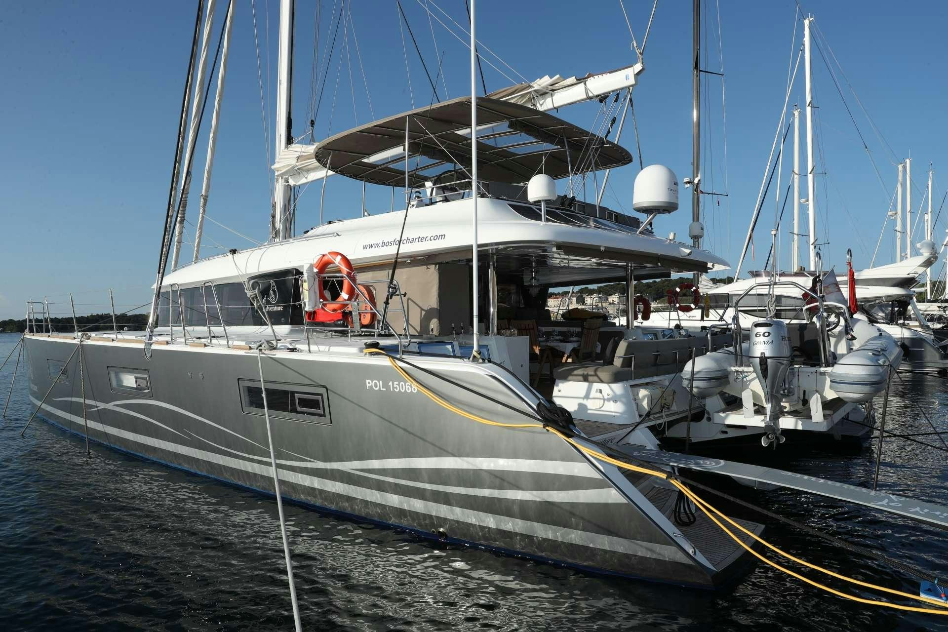 a boat docked at a pier aboard Spirit of Adventure Lagoon 620  Yacht for Charter