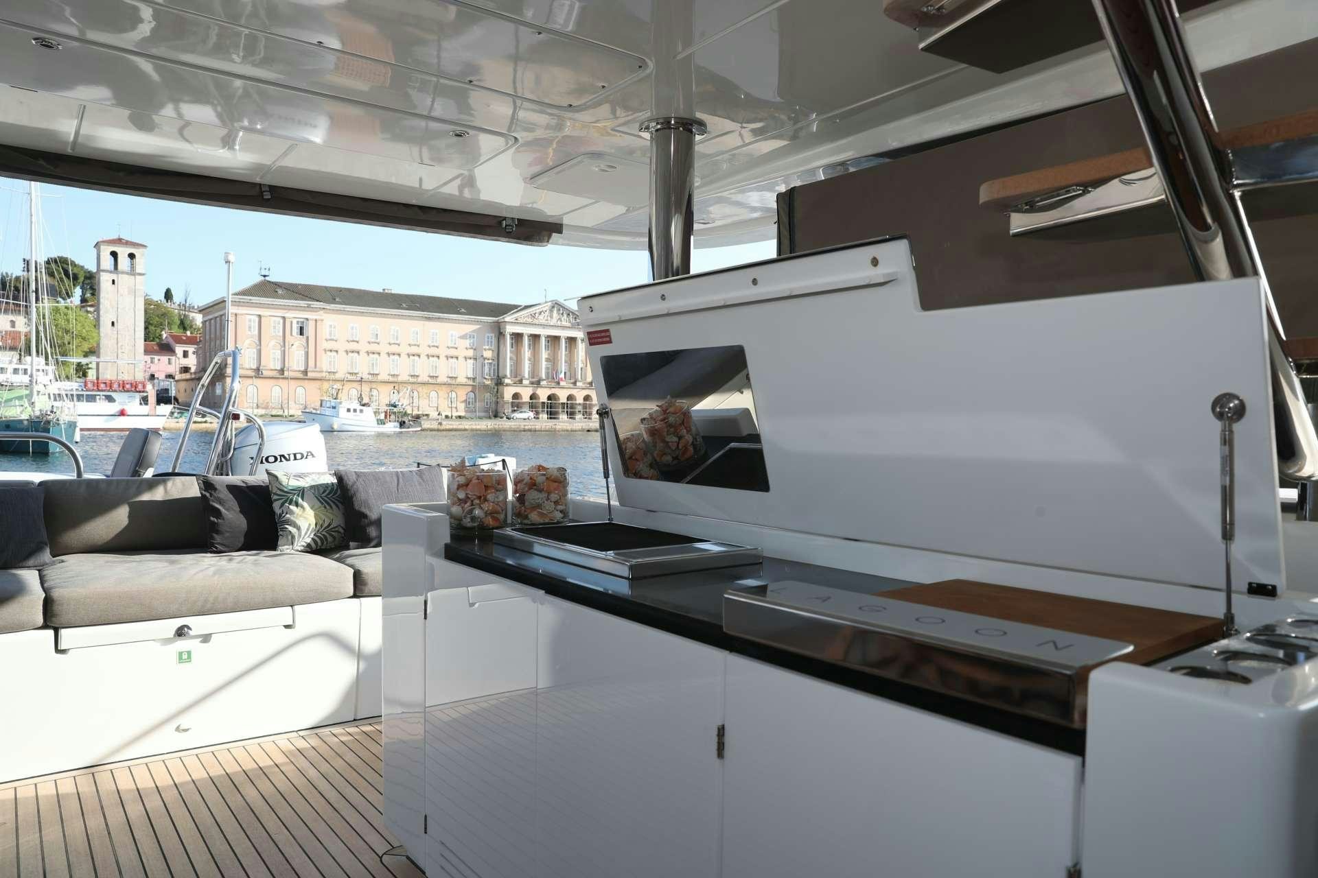 a large white printer aboard Spirit of Adventure Lagoon 620  Yacht for Charter