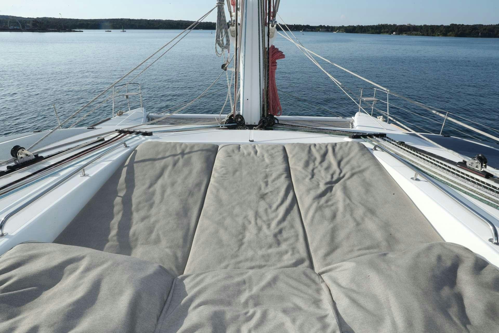 a person standing on a boat aboard Spirit of Adventure Lagoon 620  Yacht for Charter