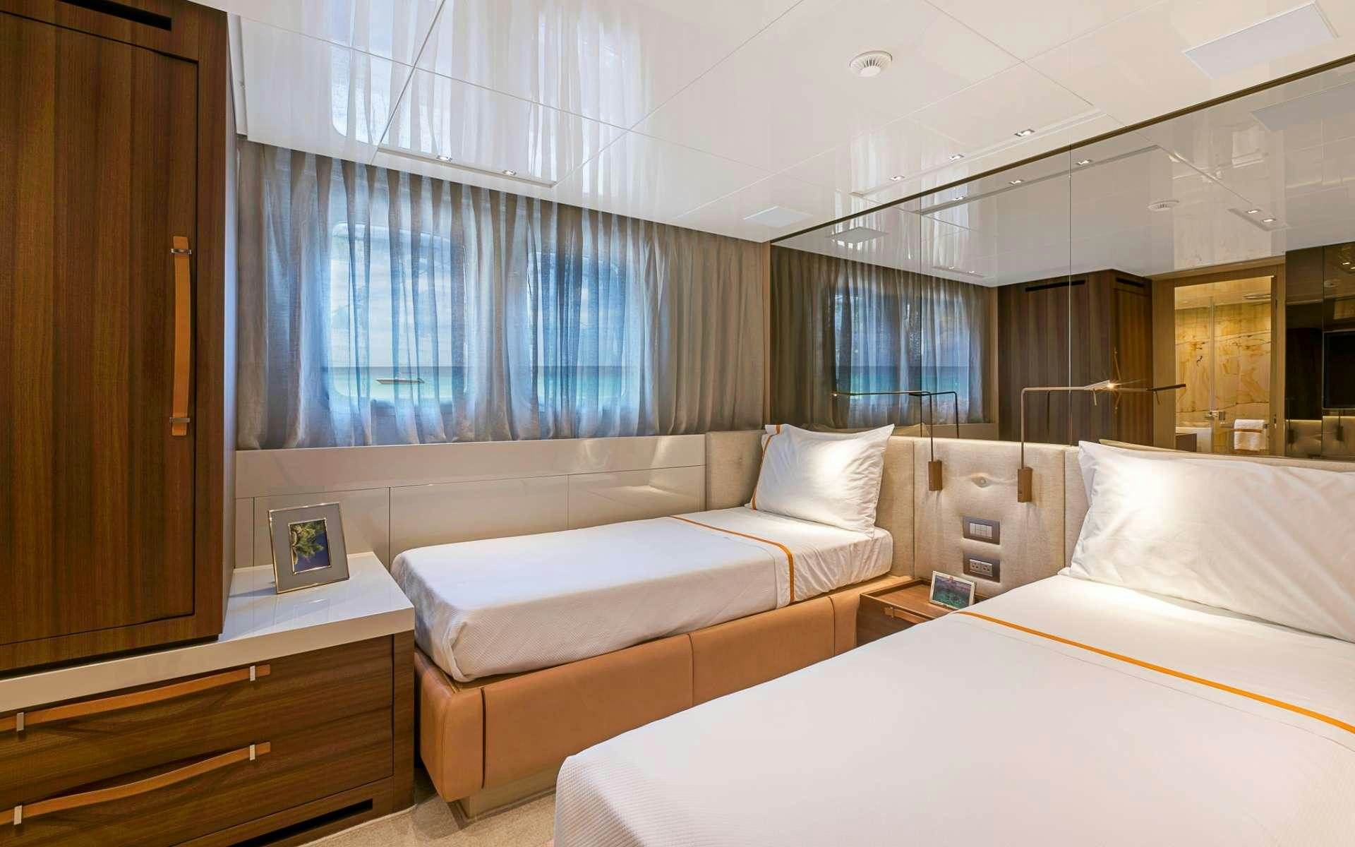 a room with two beds aboard NOTORIOUS Yacht for Charter